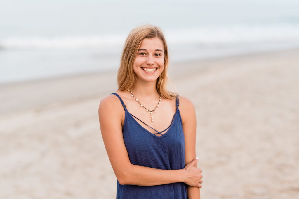 Virginia Beach high school senior photographer girl standing on the beach what to wear